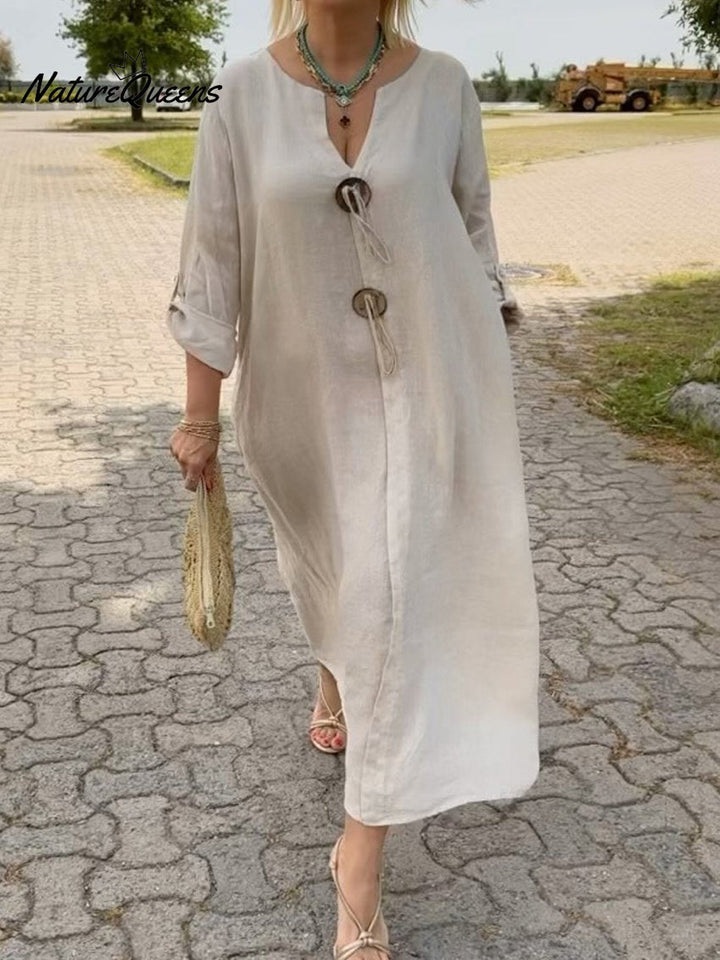 Noor – Lange jurk met houten details en losse mouwen